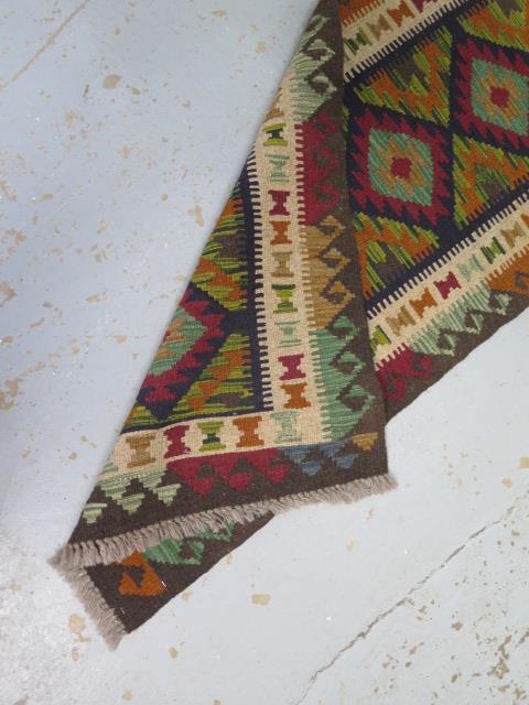 A hand knotted woollen Maimana Kilim runner, 210cm x 63cm - Image 3 of 3