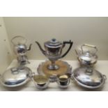 Two silver plated spirit kettles, a three piece plated coffee set, a pair of plated entree dishes
