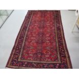 A hand knotted woollen Heriz rug, 2.8m x 1.58m