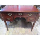 An Edwardian mahogany inlaid ebony and satinwood strung kneehole desk with red tooled leather top,