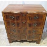 A Georgian style walnut serpentine fronted four drawer chest, 82cm tall x 75cm x 47cm