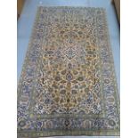 A hand knotted woollen Kashan rug, 2.44m x 1.45m