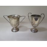 Two silver trophy engraved cups, 10cm and 9cm tall, approx 4 troy oz