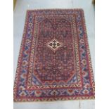 A hand knotted woollen Hamadam rug, 2.00m x 1.35m