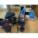 A collection of photography equipment to include a Ricoh SLX 35mm camera, wide angle lens,