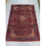 A hand knotted woollen Hamadam rug, 2.00m x 1.47m