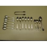 Two sets of six silver tea spoons, four other silver spoons and a sugar nip, total weight approx