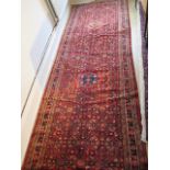 A hand knotted woollen Hamadam rug, 4.10 x 1.10m