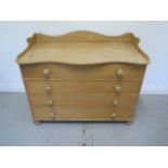 A good Victorian stripped pine four drawer chest with a shaped galleried top, 87cm tall x 110cm x
