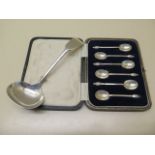 A silver ladle and a boxed set of six silver coffee spoons, total approx 4 troy oz