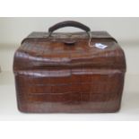 An antique crocodile travel case by James Dewsnap Ltd, Sheffield, general wear and repairs