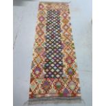 A hand knotted woollen Chobi Kilim runner, 202cm x 68cm