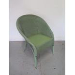 A 1954 Lloyd Loom chair, some wear but generally good