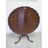 A 19th century mahogany piecrust tilt top side table on a tripod base, 72cm tall x 93cm diameter,