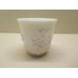 An 18th century blanc-de-chine porcelain tea cup decorated with plum blossom design, 7.5cm tall,