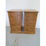A pair of new burr oak bedside chests, each with a slide above four drawers, made by a local
