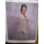 An album of 12 signed photographs and cuttings of stars of the stage including Diana Rigg, Tommy