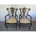 A pair of Edwardian inlaid mahogany open armchairs on cabriole shaped front legs, 99cm tall x 59cm