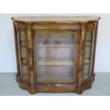 A good Victorian inlaid walnut side cabinet with ormulu mounts having a central cabinet glazed