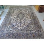 A hand knotted woollen fine Kashan lambs wool rug, 3.72m x 2.42m, some small stains but generally