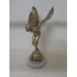 A Rolls Royce Spirit of Ecstasy showroom mascot on a marble base, hand written label Jack Barclay