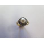 An 18ct yellow gold pearl and diamond ring, size M, marked 18ct, head approx 11mm diameter, approx