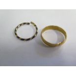 An Oriental yellow gold expandable band ring, tests to approx 18ct, approx 4 grams, and a cut hair