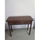 A Georgian mahogany fold over tea table with 2 small drawers on square section legs, 75cm tall x