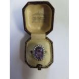 A 9ct yellow gold amethyst and pearl ring, size N, head approx 2cm x 1.5cm, approx 6 grams,