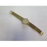 A hallmarked 9ct yellow gold Vertex Revue manual wind wristwatch, 3cm case, total length 20cm,