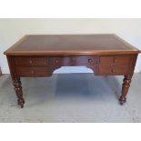 A Victorian mahogany 5 drawer writing table with a leather insert top on turned legs, 76cm tall x