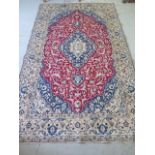 A hand knotted woollen fine Nain silk inlaid rug, 2.65m x 1.55m, some small wear