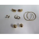 Five pairs of 9ct yellow gold earrings including a pair of diamond earrings, approx 7.7 grams