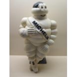 A Michelin Man lamp, 48cm tall, some restoration to body