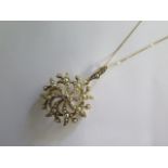 A 15ct gold Edwardian pearl and diamond pendant / brooch on a modern 18ct yellow gold 46cm chain,