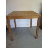 A hardwood garden patio table, 75cm tall x 79cm x 79cm