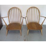 A pair of light elm low seated armchairs, 82cm tall, good condition