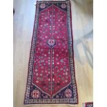 A hand knotted woollen Yallameh rug, 1.44m x 0.55m, in good condition