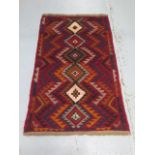 A hand knotted woollen new Baluchi rug, 136cm x 84cm