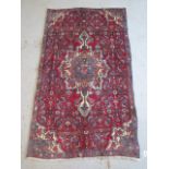 A hand knotted woollen Bijar rug, 1.95m x 1m, in good condition