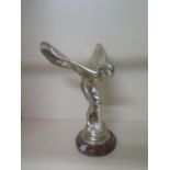 A Rolls Royce Spirit of Ecstasy showroom mascot on a marble base, 29cm tall, label underneath hand