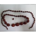 Two Bakelite / resin bead necklaces, 51cm and 44cm long, largest bead approx 3 x 2cms, some usage
