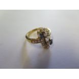 An 18ct yellow gold diamond and sapphire Art Deco style geometric design ring, size K, approx 4.5