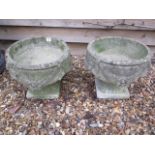 A pair of stone effect garden planters, 33cm tall x 37cm wide