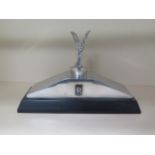 A large desk paperweight in the form of a Rolls Royce grill top, 34cm wide