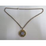 A 9ct 375 43cm chain, approx 11.2 grams, with a gilt metal locket 2.9cm wide, approx 7.1 grams, both