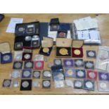 A collection of commemorative Crowns, a folder of 13 plated coins, 2 x 500 silver coins and other