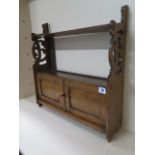 An oak wall shelf with cupboard in polished condition, with key, 54cm tall x 53cm x 14cm