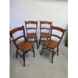 A set of four 19th century elm bar back chairs on turned legs and stretchers, in polished condition,