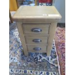 An ex display Canterbury Oak 3 drawer bedside chest retail £140 58 cm tall 41 x 32